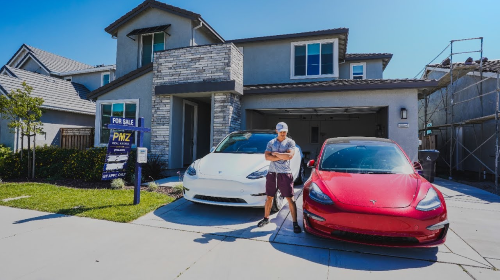 Nico Murillo, the Tesla employee who was laid off, stands next to his cars and house. Photo via - https://www.youtube.com/@NicoMurillo