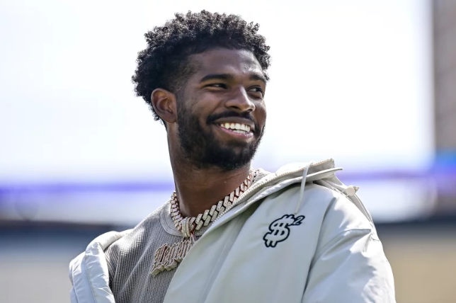 Shedeur Sanders flashes a smile during his jersey retirement ceremony at Colorado’s Black and Gold Spring Game on April 19 — just days before his NFL future was sealed by the Cleveland Browns. Photo: Dustin Bradford/Getty Images for ONIT