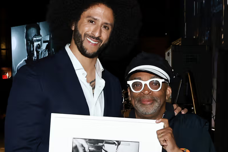 Colin Kaepernick and Spike Lee share a moment at an event celebrating Black filmmakers, before their ESPN docuseries was unexpectedly scrapped. Photo: Arturo Holmes/Getty Images